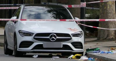 Blood smeared across Mercedes as double stabbing leaves man, 23, fighting for his life