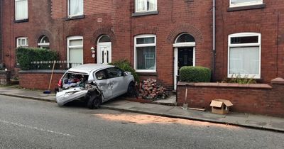 Audi driver leaves cars and garden wall wrecked after 'losing it' in residential street