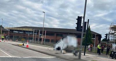 Busy main road near Manchester city centre closed after van FLIPS onto roof in crash with BMW