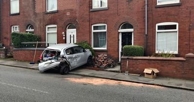 'Speeding' Audi driver smashes through garden wall into front of terraced home
