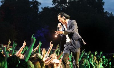 Nick Cave and the Bad Seeds review – Cave lures adoring crowd into his arms