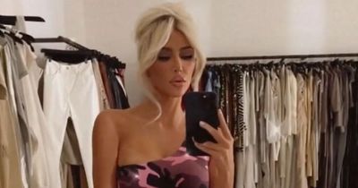 Kim Kardashian channels Barbie in clinging pink dress as she regrets 'get a job' row