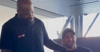 UFC champion looks tiny standing beside 300lb basketball legend Shaquille O'Neal