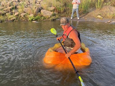 Nebraska man claims world record for paddling 38 miles – in a pumpkin