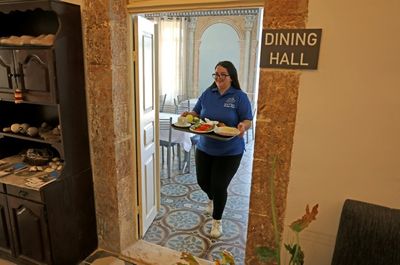 Welcome: Palestinians with disabilities out front at Bethlehem hotel