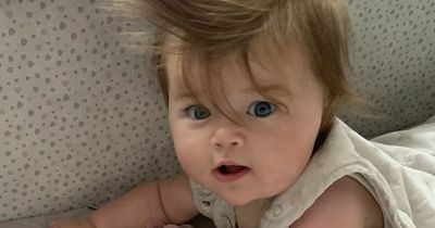 Baby with 80s' George Michael bouffant leaves strangers stunned