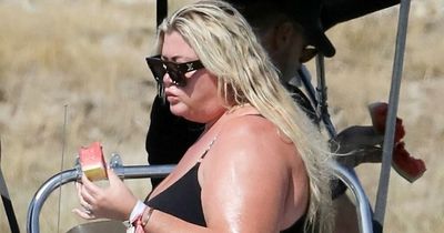 Gemma Collins tucks into watermelon on a yacht in Greece as Rami sunbathes in his pants
