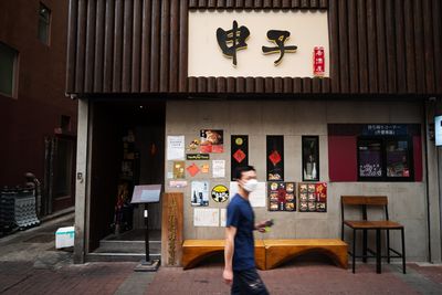 Hong Kong’s ‘yellow’ companies see persecution in COVID crackdown