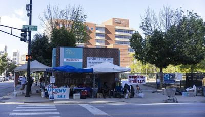 Cops remove activists protesting planned luxury high-rise at Weiss Hospital parking lot in Uptown