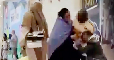 Two burka-clad women brawl in front of shoppers and young kids in busy Irish shopping centre