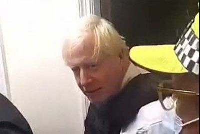 Boris Johnson caught on video during early morning police raid of stunned rapper’s home