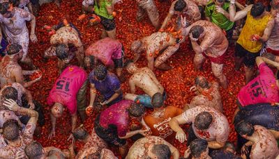 Spain’s La Tomatina street tomato fight is back after a pandemic hiatus (and messy)