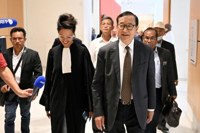 Cambodian dissident fights defamation claims at French trial