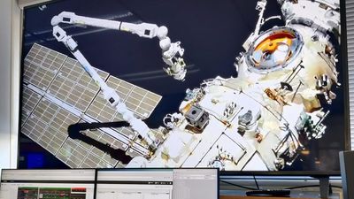 Robotic space arm successfully completes test by moving a suitcase-sized object around the International Space Station