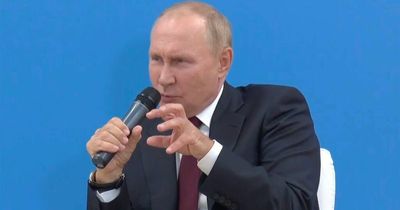 Playful Putin giggles as he makes baffling bum joke to bemused high-IQ Russian kids