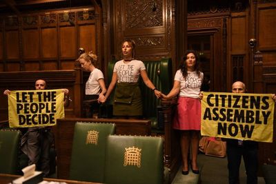 Climate protesters superglue themselves around Commons Speaker’s chair