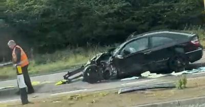 Car mangled and ambulance damaged in three-vehicle crash on Scots road