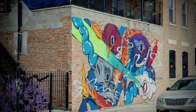 Artist says this mashup in a Pilsen mural of birds and feathers and a beam of light is about ‘paying attention to nature’