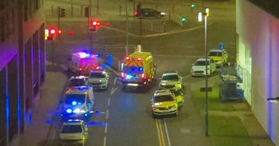 Man arrested after woman plunges from third floor apartment balcony at 2am