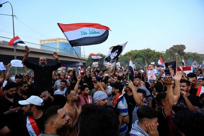 Thousands in Iraq demand regime change after Shia factions clash