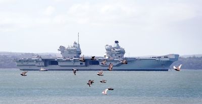 Broken down Royal Navy aircraft carrier returns to home base ahead of repairs