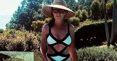 Patsy Palmer, 50, stuns in cut-out swimsuit as she poses by the pool in Malibu