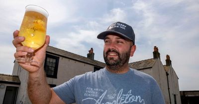 Electrician becomes landlord of tiny British island - and is coronated with a beer shower