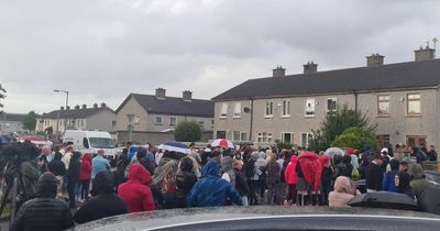 Tallaght stabbings: Balloons released as crowd gathers with flowers and candles at home of siblings