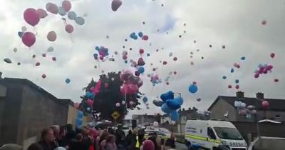 Family and friends release balloons at vigil held in memory of Tallaght siblings
