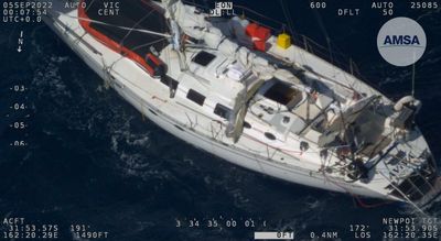 Rescue mission under way for two Australians stranded on damaged yacht in Tasman Sea