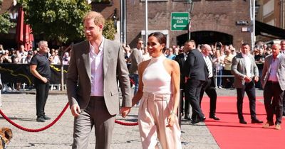 Harry and Meghan have red carpet rolled out for them as they arrive in Germany
