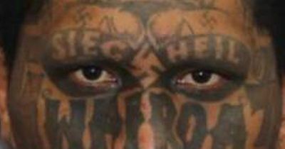 Wanted man's mugshot deemed 'scariest ever' because of vile and offensive tattoos