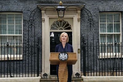 Protesters blast Mad World as Liz Truss warns of 'storm' facing UK in first speech