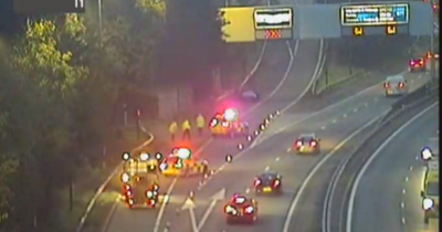 Woman rushed to hospital as early morning M77 crash sparks rush hour delays