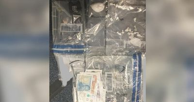 Man arrested after being found with wraps of heroin and a gun
