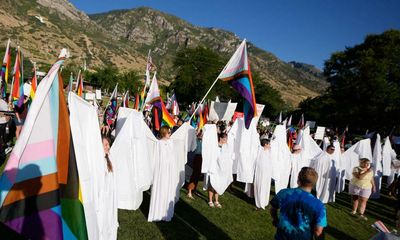 Angels with large ‘wings’ shield students from harm at Utah pride march