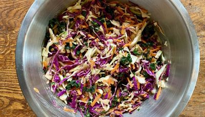 Onion-infused dressing elevates this colorful, crunchy coleslaw