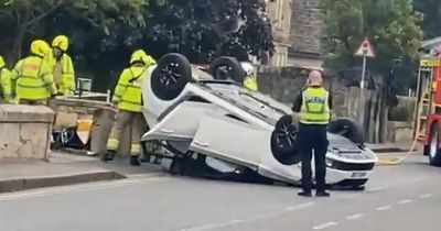 Car flips onto roof in crash as emergency crews race to Scots street