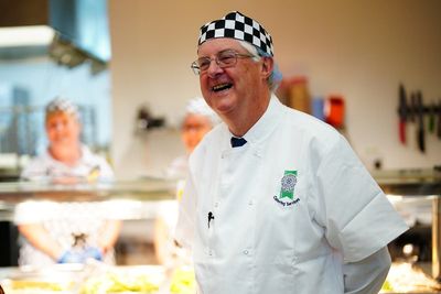 Mark Drakeford serves free school meals to primary school children