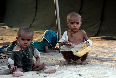 Pakistani volunteers search villages to rescue flood victims