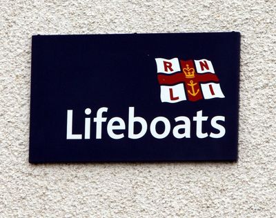 Two rescued from life raft after abandoning sinking boat