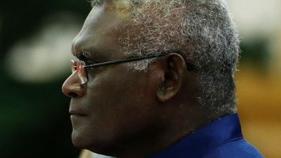 Solomon Islands parliament votes to delay national poll as Manasseh Sogavare mocks Australia's election fund offer