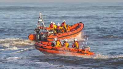 Two people rescued from life raft after abandoning sinking vessel