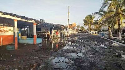 Kay weakens to tropical storm, leaves strong rains and winds