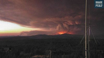 California's Mosquito Fire jumps river, threatening homes and creating its own weather