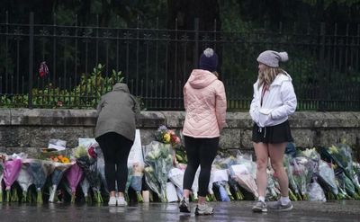 Flowers and messages of thanks left at Balmoral gates after Queen's death