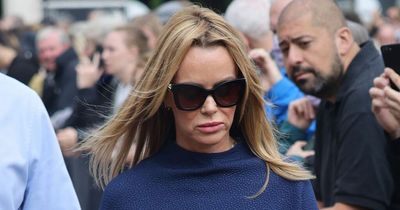 Amanda Holden cuts a sombre figure as she pays respects to Queen at Buckingham Palace