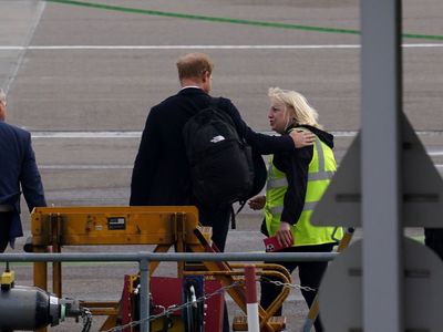 Touching moment Prince Harry comforts airport worker as he flies out from Balmoral
