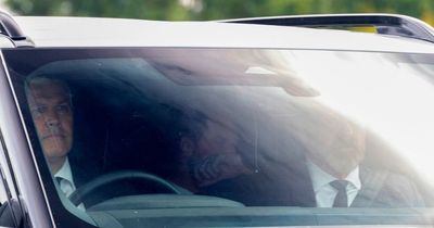 Sombre Prince Harry lands in Windsor to be with Meghan after night mourning with family