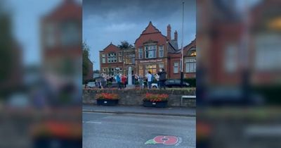 Touching moment crowd breaks into national anthem after Queen's death